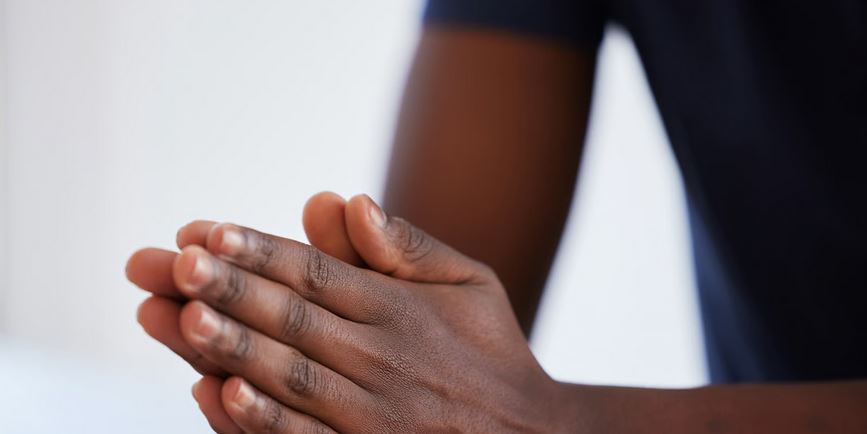 Hands open in prayer