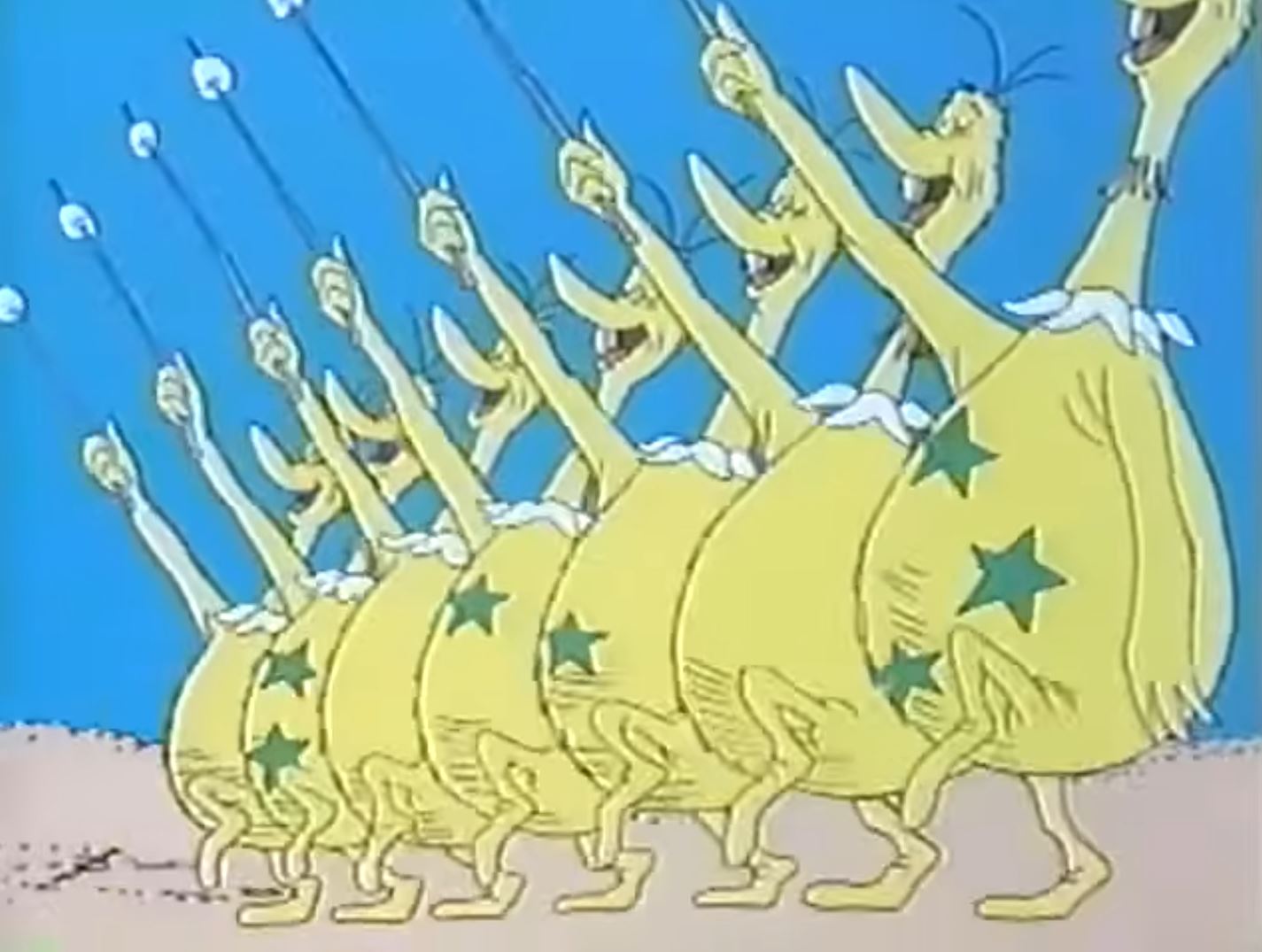 A group of people gathered on a beach at golden hour